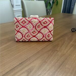 Chic Red and Gold Clutch with Elegant Design